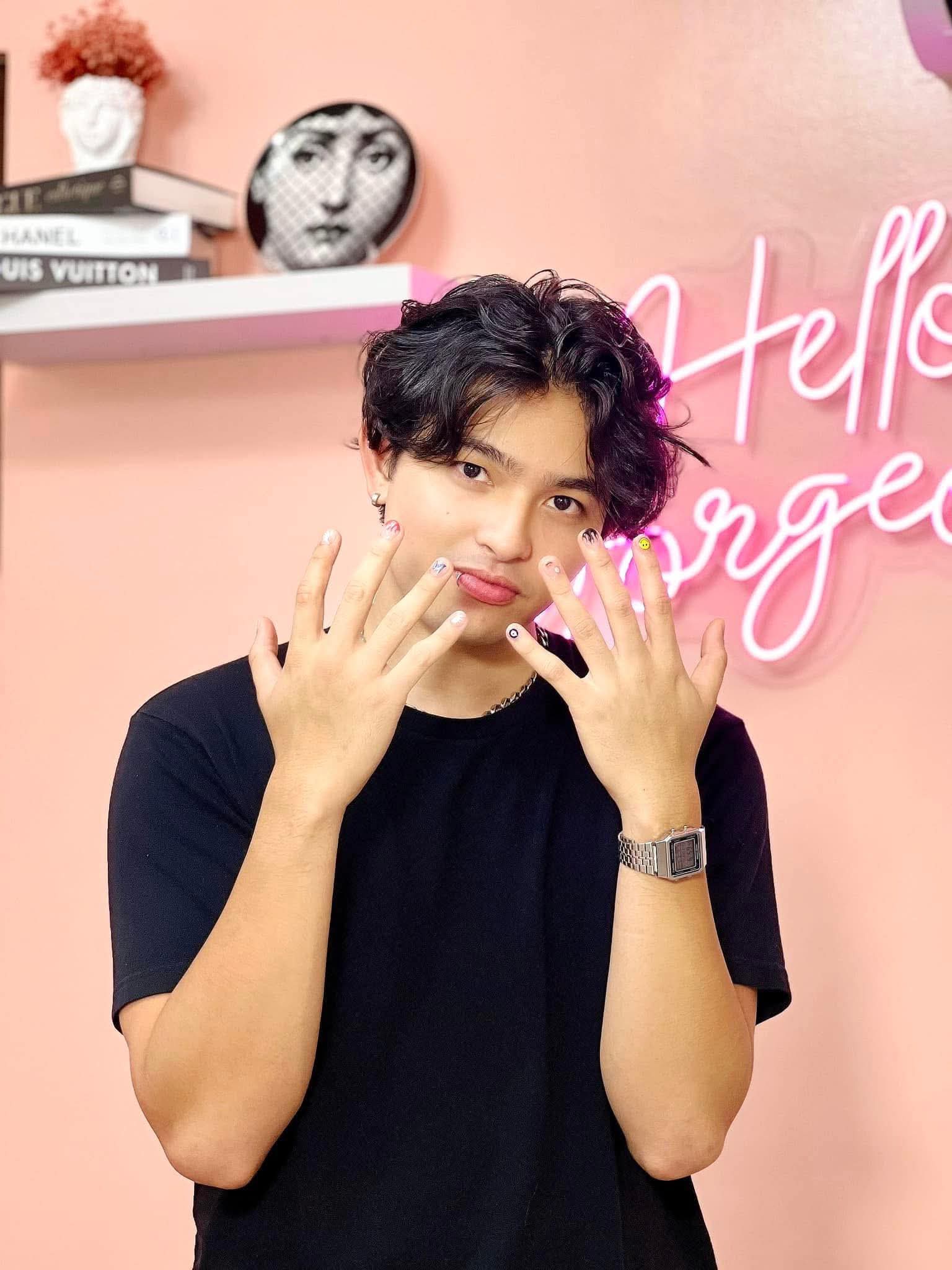 male client with colourful mixed nail art designs at AyuriNails Beauty Lounge Makati